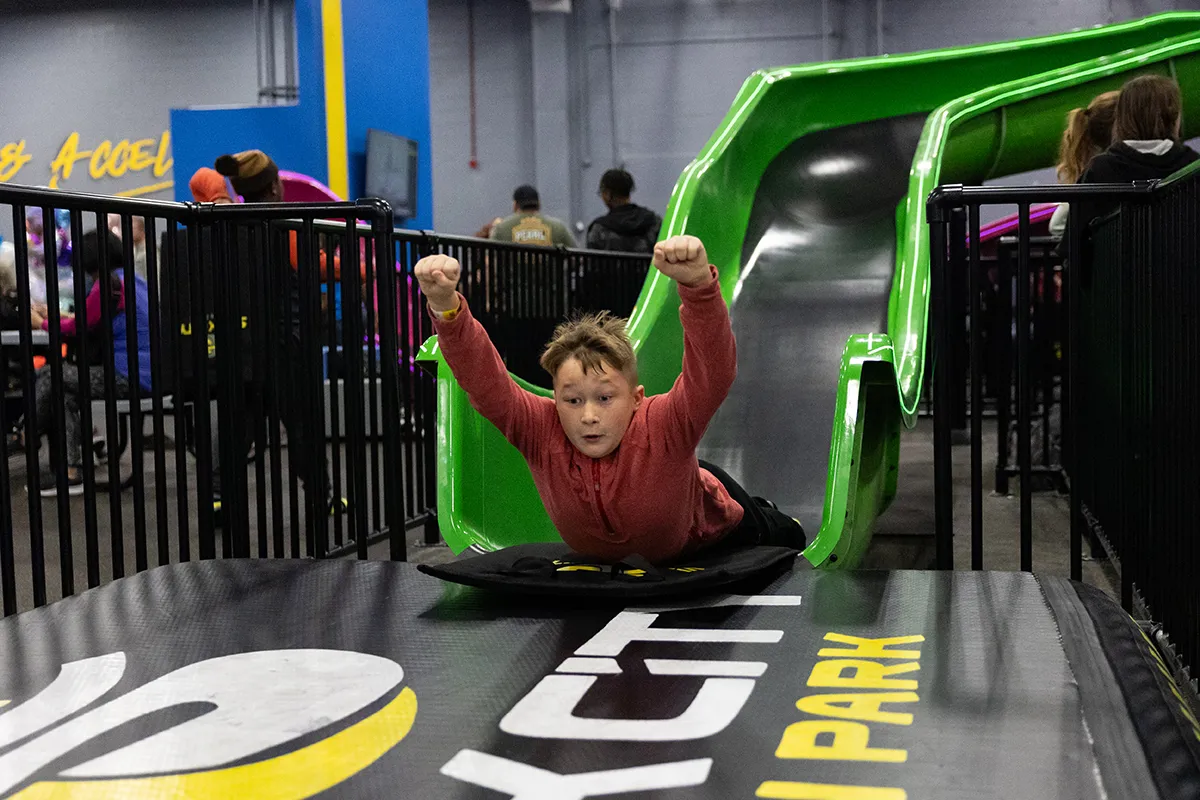 child on cowabunga slide