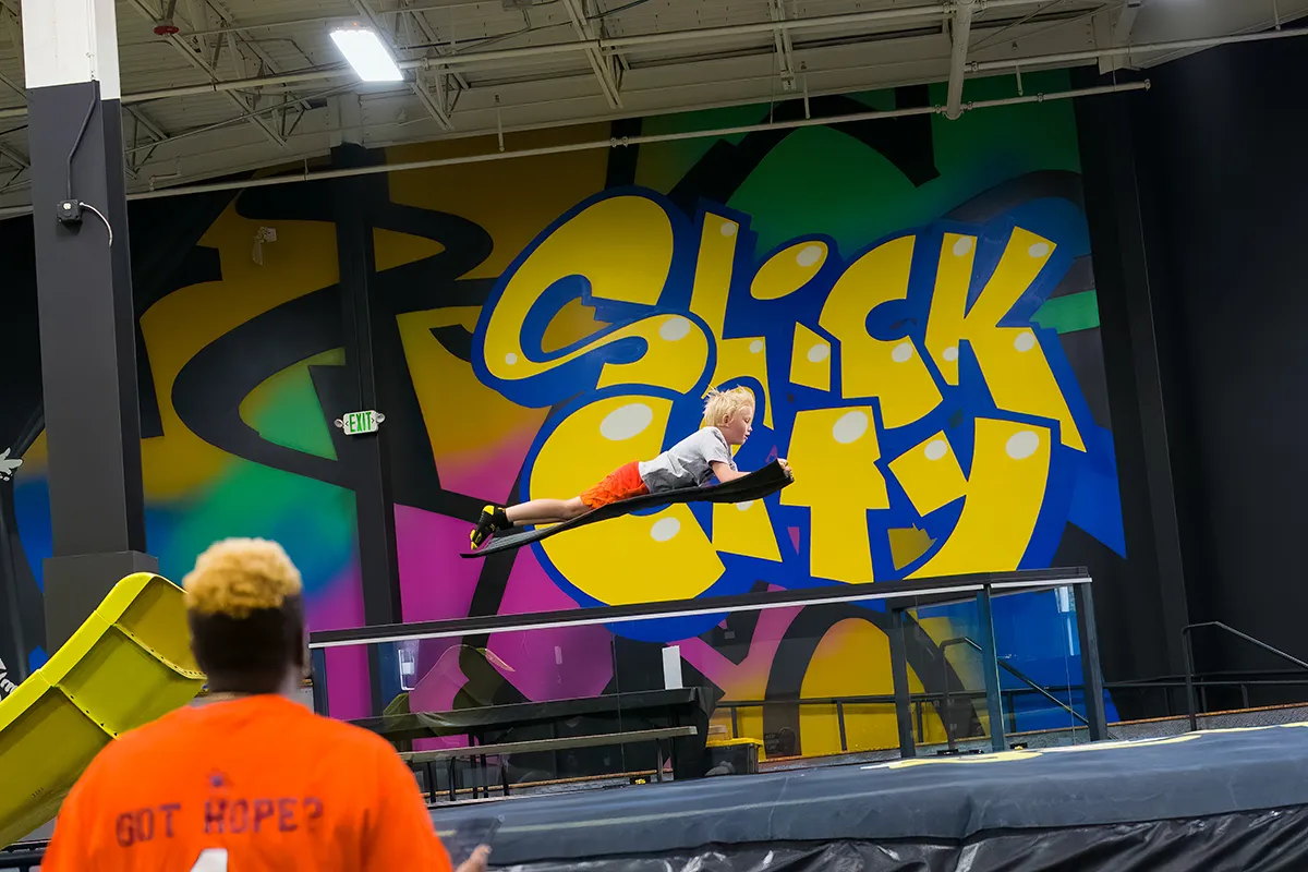 child at mega launch slick city