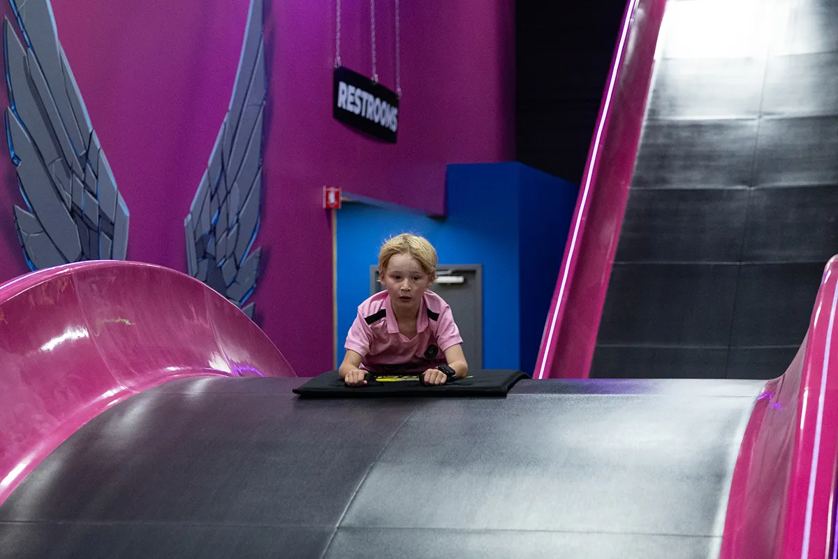 young child on dragon slide