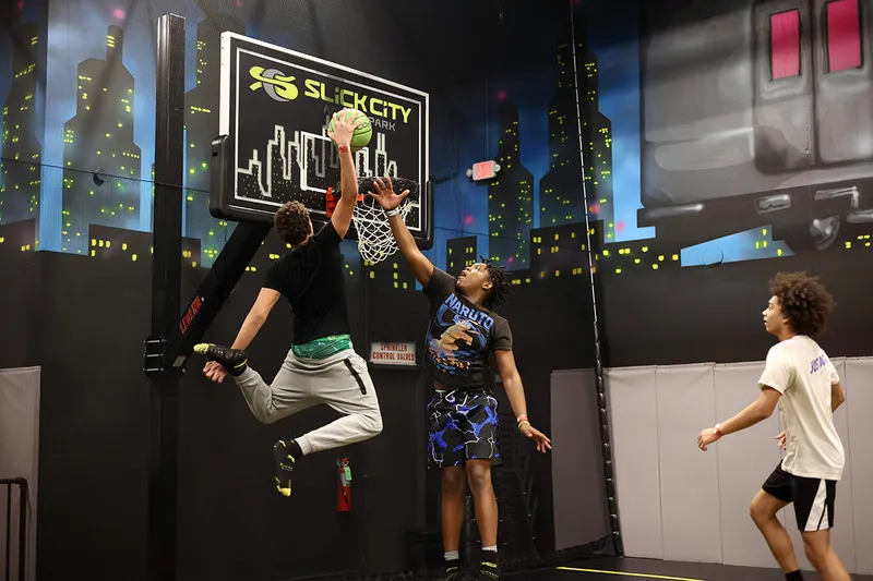 teens playing air court basketball