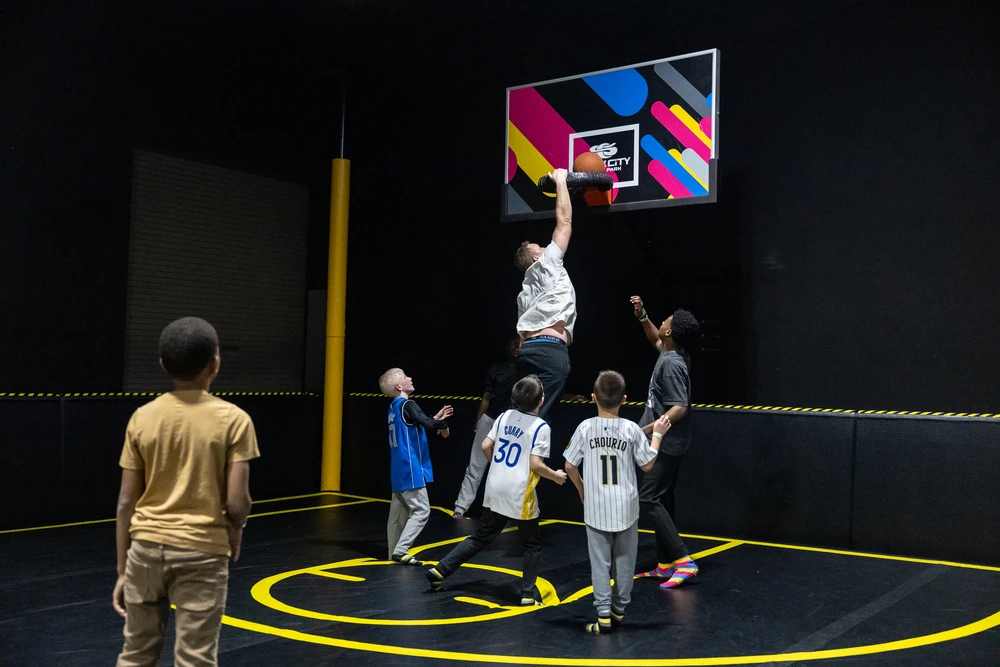 group of kids playing basketball on Air Court at Slick City Action Park